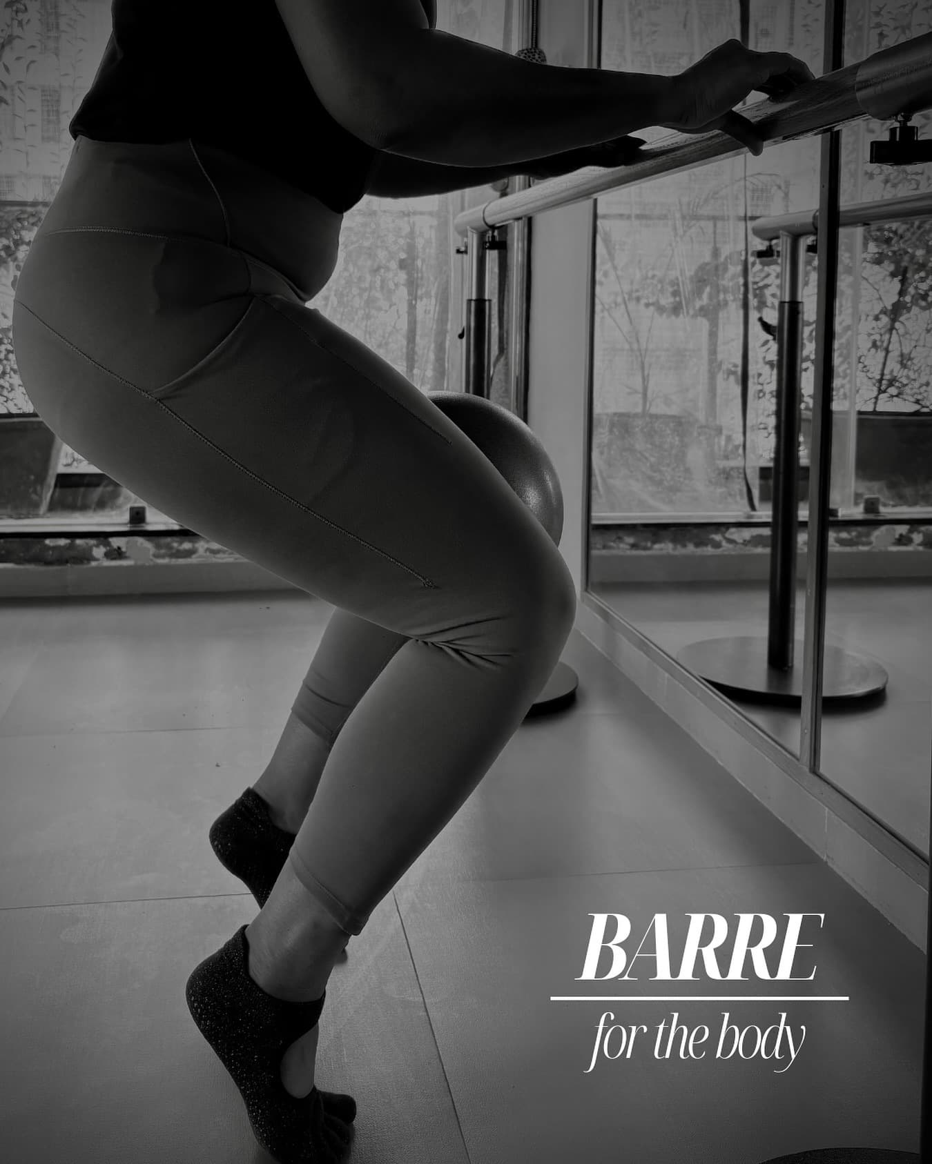 Black-and-white photo of a woman at the ballet barre, one hand on the rail mid-exercise, captioned "Barre — for the body".